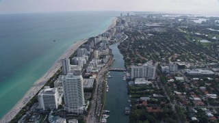 6.7K aerial stock footage tilt from Indian River for a wide view of Miami Beach, Florida Aerial Stock Footage | AX0172_138