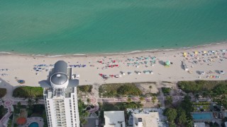 6.7K aerial stock footage of sunbathers on the beach in Miami Beach, Florida Aerial Stock Footage | AX0172_139