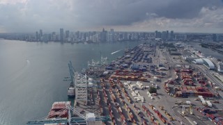 AX0172_146 - 6.7K aerial stock footage of flying over Port of Miami to approach Downtown Miami, Florida