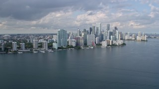 AX0172_150 - 6.7K aerial stock footage of approaching the skyline of Downtown Miami, Florida