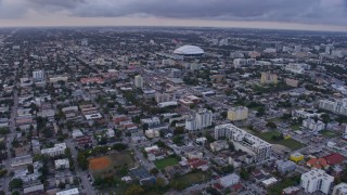 6.7K aerial stock footage fly over Little Havana neighborhood to approach stadium at sunset, Miami, Florida Aerial Stock Footage | AX0172_177