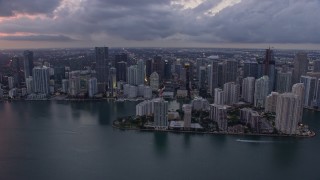 6.7K aerial stock footage fly over Biscayne Bay to approach Downtown Miami skyline at twilight, Florida Aerial Stock Footage | AX0172_199