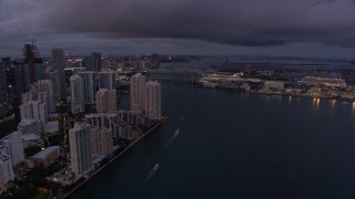 6.7K aerial stock footage reverse view of Brickell Key and Downtown Miami skyscrapers at twilight, Florida Aerial Stock Footage | AX0172_207