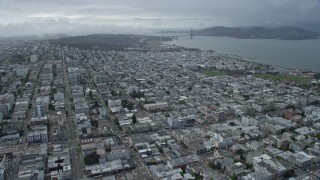 6K aerial stock footage of approaching the Marina District neighborhood and Golden Gate Bridge in San Francisco, California Aerial Stock Footage | AX0173_0049