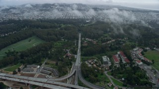 AX0173_0061 - 6K aerial stock footage follow Veterans Blvd to the MacArthur Tunnel in The Presidio, San Francisco, California