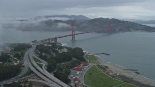 6K aerial stock footage fly through a fog bank to reveal the Golden Gate Bridge, California Aerial Stock Footage | AX0173_0096