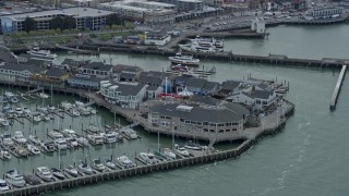 AX0173_0106 - 6K aerial stock footage of flying past the famous Pier 39 in San Francisco, California