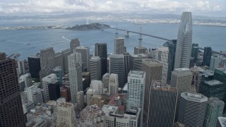 AX0173_0125 - 6K aerial stock footage fly over Downtown San Francisco toward Yerba Buena Island and Bay Bridge, California