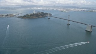 6K aerial stock footage flyby the Bay Bridge toward Yerba Buena Island, California Aerial Stock Footage | AX0173_0126