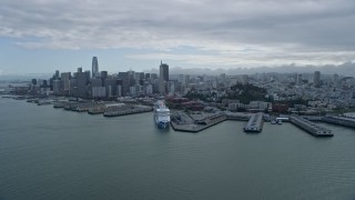 6K aerial stock footage flyby North Beach piers with view of Downtown San Francisco skyline, California Aerial Stock Footage | AX0173_0128