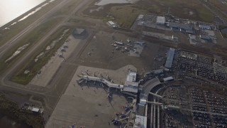 AX0174_0002 - 6K aerial stock footage of a bird's eye view of the control tower and terminals at Oakland Airport, California