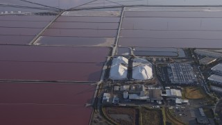 6K aerial stock footage of flying by mounds of salt and marshes, Newark, California Aerial Stock Footage | AX0174_0014