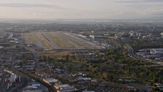 AX0174_0032 - 6K aerial stock footage of San Jose International Airport at sunset, California