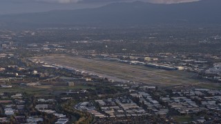 AX0174_0046 - 6K aerial stock footage of San Jose International Airport at sunset, California