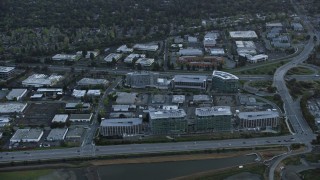 AX0174_0054 - 6K aerial stock footage of Facebook office buildings at sunset, Menlo Park, California