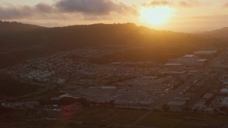 6K aerial stock footage flyby suburban neighborhood around the Cow Palace at sunset, Daly City, California Aerial Stock Footage | AX0174_0074