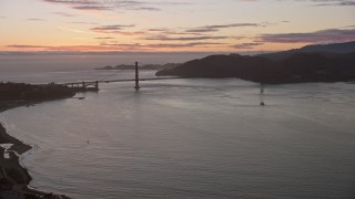 6K aerial stock footage of flying over Marina District toward the Golden Gate Bridge and setting sun, San Francisco, California Aerial Stock Footage | AX0174_0094