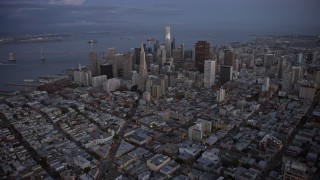 AX0174_0106 - 6K aerial stock footage approach Downtown San Francisco skyscrapers from Russian Hill at twilight, California