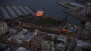 AX0174_0109 - 6K aerial stock footage of Oracle Park baseball stadium at twilight, California