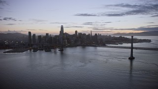 AX0174_0111 - 6K aerial stock footage of flying away from Downtown San Francisco skyline at twilight, California