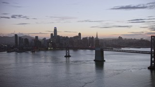 AX0174_0112 - 6K aerial stock footage fly away from Downtown San Francisco skyline at twilight, California