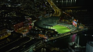 AX0174_0142 - 6K aerial stock footage of circling Oracle Park stadium at night, San Francisco, California