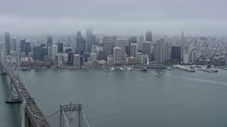 6K aerial stock footage of the Downtown San Francisco skyline seen while flying near the Bay Bridge, California Aerial Stock Footage | AX0175_0004