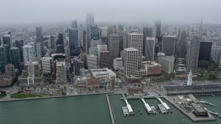 6K aerial stock footage fly over the bridge toward Downtown San Francisco skyline, California Aerial Stock Footage | AX0175_0005