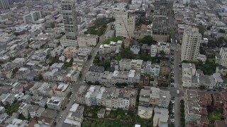 6K aerial stock footage of Russian Hill apartment buildings in San Francisco on a foggy day, California Aerial Stock Footage | AX0175_0009