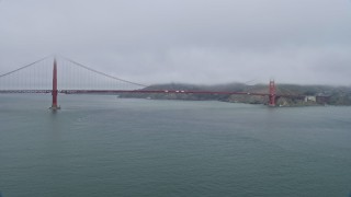 6K aerial stock footage of flying by the Golden Gate Bridge on a foggy day, San Francisco, California Aerial Stock Footage | AX0175_0029