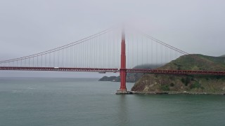 6K aerial stock footage flyby the Marin side of the Golden Gate Bridge on a foggy day, San Francisco, California Aerial Stock Footage | AX0175_0031