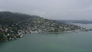 6K aerial stock footage of homes overlooking the bay in Sausalito on a foggy day, California Aerial Stock Footage | AX0175_0033