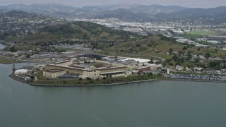 AX0175_0048 - 6K aerial stock footage of a reverse view of San Quentin State Prison from the water, California