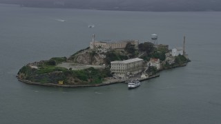 6K aerial stock footage of orbiting Alcatraz on a foggy day, California Aerial Stock Footage | AX0175_0070