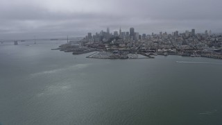 6K aerial stock footage a wide view of the Downtown San Francisco skyline on a foggy day, California Aerial Stock Footage | AX0175_0071