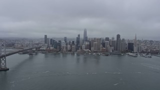 6K aerial stock footage of Downtown San Francisco on a foggy day, seen from the bay, California Aerial Stock Footage | AX0175_0075