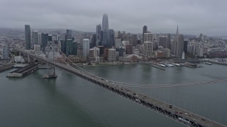 6K aerial stock footage of Downtown San Francisco on a foggy day, seen from the Bay Bridge, California Aerial Stock Footage | AX0175_0076