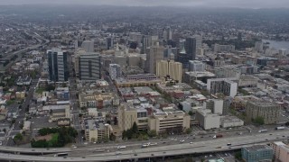 6K aerial stock footage of Downtown Oakland office buildings on a foggy day, California Aerial Stock Footage | AX0175_0083