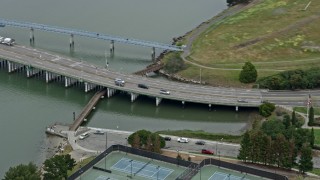 AX0175_0096 - 6K aerial stock footage cars on a small bridge in Alameda, California