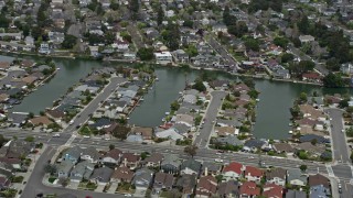 AX0175_0098 - 6K aerial stock footage of waterfront homes by canals in Alameda, California