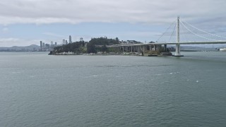 AX0175_0113 - 6K aerial stock footage of flying low toward Yerba Buena Island in San Francisco Bay, California