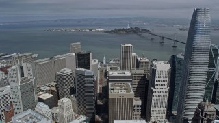 AX0175_0121 - 6K aerial stock footage follow Market Street over Downtown San Francisco toward the bay, California