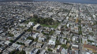 6K aerial stock footage of fly over urban neighborhoods to circle Alamo Square, Western Addition, San Francisco, California Aerial Stock Footage | AX0175_0139