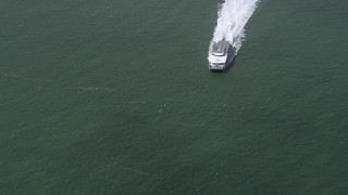 AX0175_0203 - 6K aerial stock footage of a ferry sailing on San Francisco Bay, California