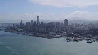 6K aerial stock footage of the Downtown San Francisco skyline seen while flying over the bay, California Aerial Stock Footage | AX0175_0213