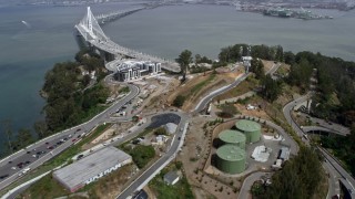 AX0175_0214 - 6K aerial stock footage approach Yerba Buena Island, tilt to condo complex, California