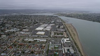 AX0175_0219 - 6K aerial stock footage of flying over waterfront neighborhoods and mall in Alameda, California