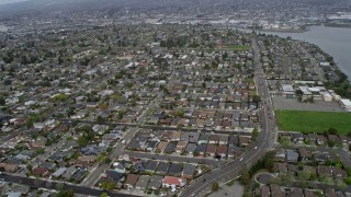 6K aerial stock footage of flying past suburban neighborhoods in Alameda, California Aerial Stock Footage | AX0175_0220