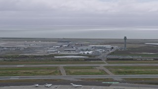 6K aerial stock footage of control tower and hangars at Oakland Airport, California Aerial Stock Footage | AX0175_0222