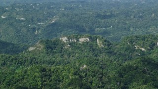 4.8K aerial stock footage of Limestone cliffs and lush green forests, Karst Forest, Puerto Rico Aerial Stock Footage | AX101_069